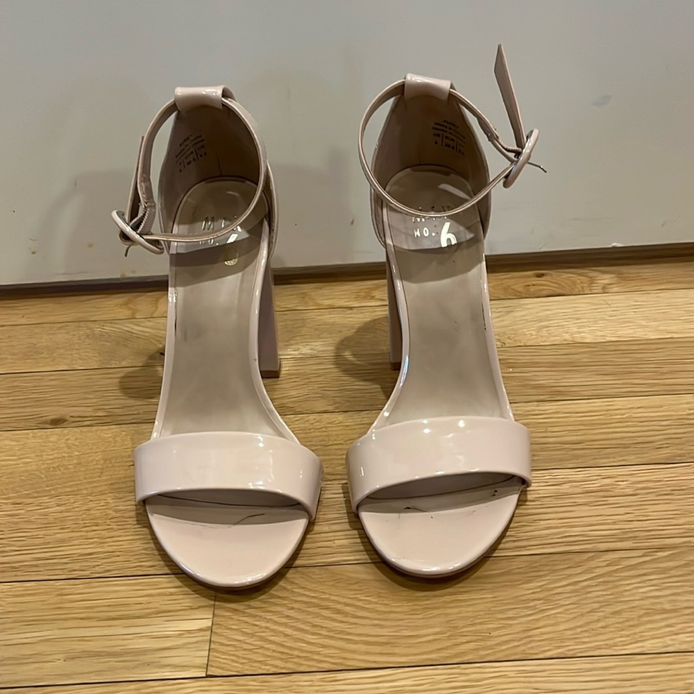 Nude patent leather block heel sandals.